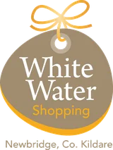 Logo for White Water Shopping in Newbridge, Co. Kildare, featuring a circular brown and gold design with a ribbon bow at the top.